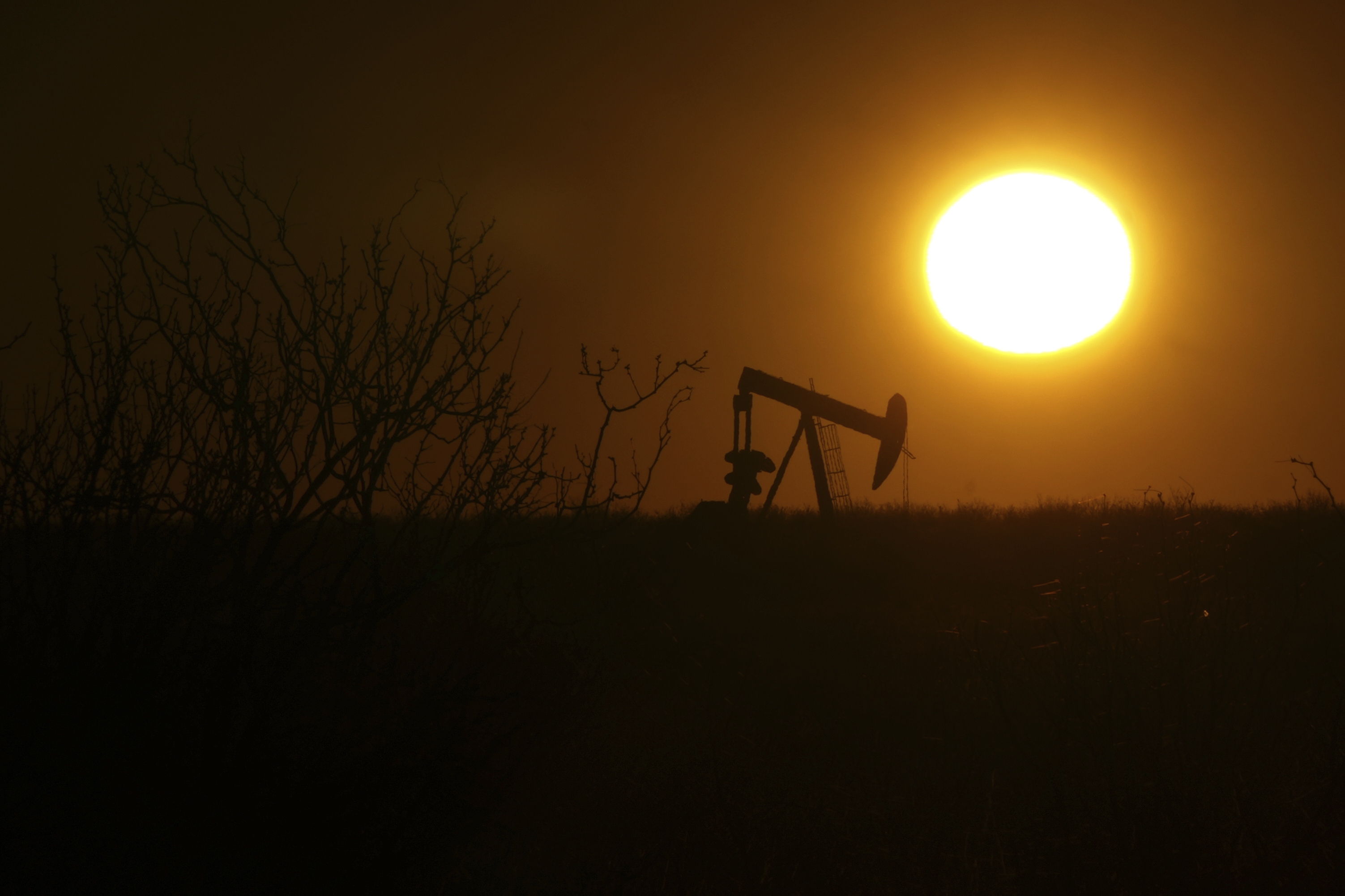 A pumping jack is visible at sunrise on Feb. 24, 2025, in Hobbs, New Mexico.